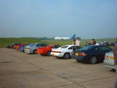 Cars in the pits waiting to go onto the track ...